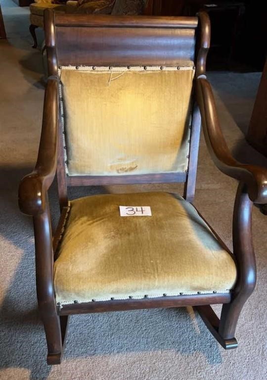 Antique upholstered rocking chair