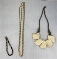 Bone necklace
Bracelet and gold