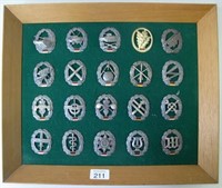 Panel twenty German army beret badges