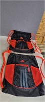 TWO ADIDAS STRING BAGS