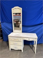 Wood desk with mirror and 4 drawers and chair.