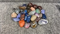 Polished mineral rocks and 3 nuts