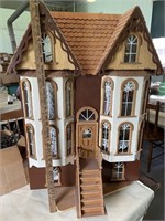 Homemade doll house on spinning base with