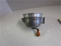 Vintage stainless steel juicer with crank