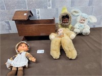 Vintage dolls and plush toys with cradle