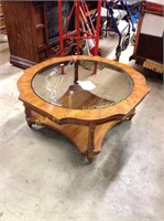 Glass top coffee table. 16.75"h x 36"w