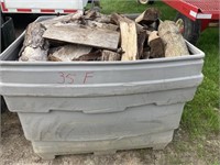 Large gray tote w/ hardwood firewood