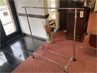 ROLLING CLOTHES RACK APPROX 4 FT LONG X 56 IN TALL