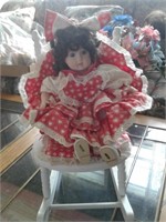 PORCELAIN DOLL IN ROCKING CHAIR