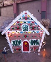 Lighted Christmas gingerbread house yard art,