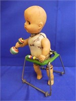 Vintage Tin Rubber Baby In Walker ( Over Wound )