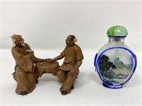 Asian snuff bottle and mudmen figurine