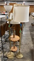 Two gold base floor lamps