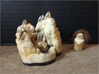 2 carved bone pieces, a penguin rookery and an