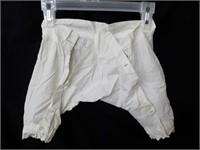 Antique infant bloomers stained