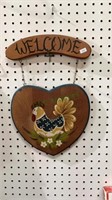 Toll painted welcome sign featuring a heart and a