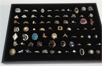 (73) COSTUME JEWELRY RINGS. TRAY NOT INCLUDED.