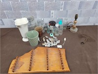 Antique glass baby bottles, spoons, electric lamp