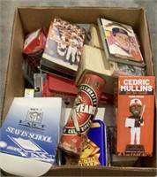 Large box of sports memorabilia includes VHS