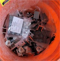 Bucket of nuts bolts and various construction
