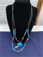 Turquoise necklace with bear and feather