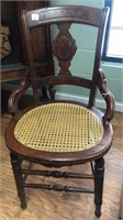 Antique cane seat chair in walnut