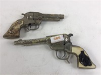 Buck bronc & Texan Jr toy guns.