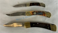 Group of three folding knives including buck