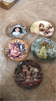 Five collector plates with wall mounts