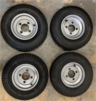 LOT OF 4 NEW TIRES WITH RIMS