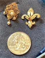 Two 14 karat gold pendants
