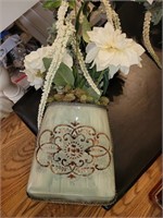Metal Wall Sconce with flower arrangement