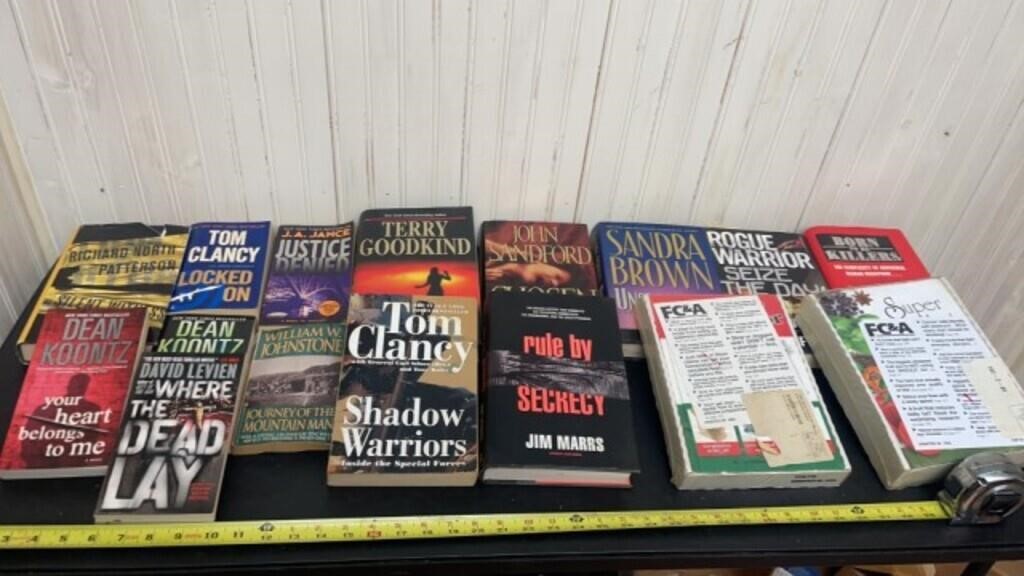 Books including Tom Clancy, Patterson, Sandra