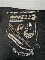 Large group of jewelry and belts