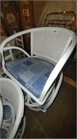 4 white cushioned chairs