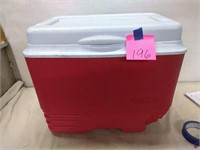 Red Rubbermaid cooler, missing wheels