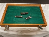 Glass/ wood display case w/ three pocket knives