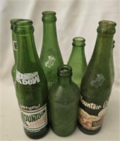 Lot of 7 vintage mountain dew bottles