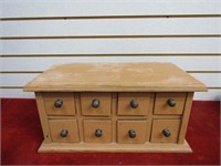 Small wood cabinet w/8 drawers.