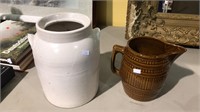 White pottery crock and a brown pottery picture