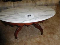 Oval marble-top coffee table w/ tear drops