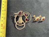 Vintage metal red rhinestone brooch marked 1/20