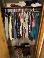 Closet full of miscellaneous clothing and shoes