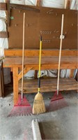 Two wire rakes and broom