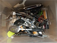 Plastic tub of assorted kitchen utensils