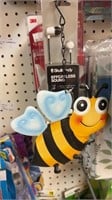 Metal bee, command strips and earbuds