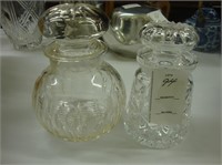 Two cut crystal dresser jars.