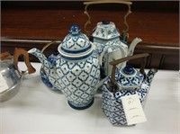 Five blue and white teapots.