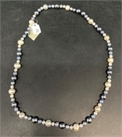Mixture of assorted pearls on necklace