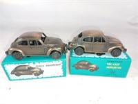 C7) TWO VW bronze pencil sharpeners. With boxes.